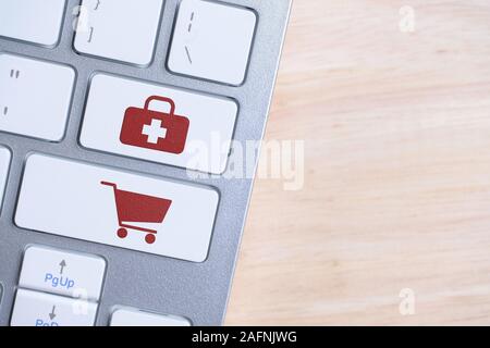 The concept of buying medicines online. Red signs on keyboard buttons. Close up. Stock Photo