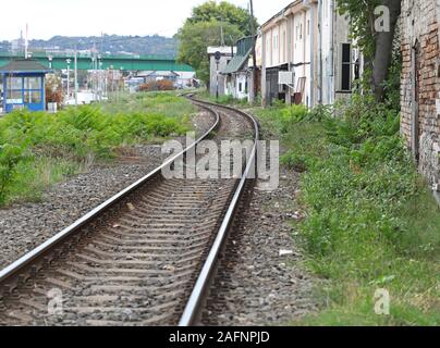 Railway line passing through slum Stock Photo