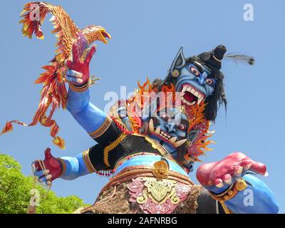 KUTA, INDONESIA - MARCH, 18, 2018: low angle shot of an ogoh-ogoh statue with a garuda at kuta beach in bali Stock Photo