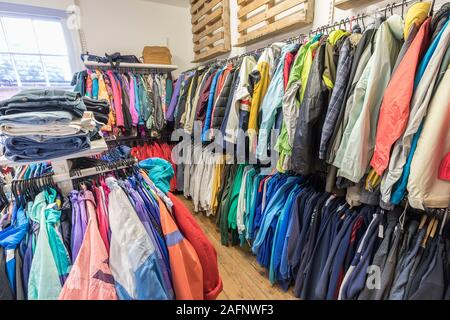Second hand used clothes for sale, England, UK Stock Photo