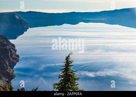 Cloud reflections on the calm surface of Crater Lake in Crater Lake National Park, Oregon, USA Stock Photo