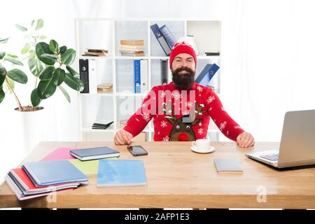 Keeping festive. Happy businessman in Christmas jumper. Fashion hipster in office. Fashion knitwear for winter holidays. Fashion trends for holiday celebration. Merry Christmas. New year new fashion. Stock Photo
