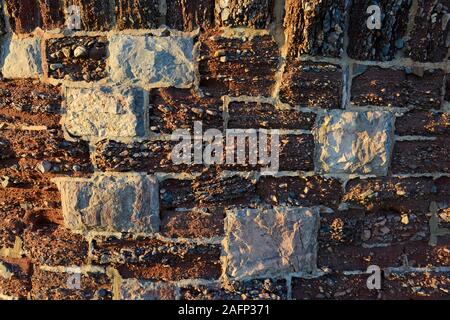 Rocks of clay and pebbles form part of a wall at Torquay in Devon. Stock Photo