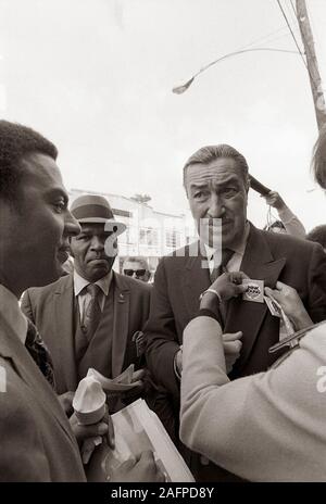 Andrew J. Young - who would later become mayor of Atlanta and U.S. Ambassador to the United Nations - runs into disgraced Congressman Adam Clayton Powell (right) as he stumps for votes during his bid for Congress in 1970 from Georgia's 5th Congressional district. Andrew Jackson Young, born March 12, 1932, is an American politician, diplomat, activist and pastor from Georgia. He has served as a Congressman from Georgia's 5th congressional district, the United States Ambassador to the United Nations, and Mayor of Atlanta. He served as President of the National Council of Churches USA, was a memb Stock Photo