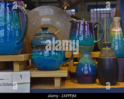 Beautiful blue jugs, cups and vases at the Ottawa Potters Guild annual Holiday Sale, Horticulture Building, Lansdowne Park, Ottawa, Ontario, Canada. Stock Photo