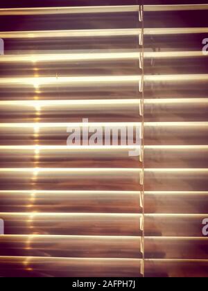 Aluminum Louver or glass shutter closed on window. Vintage color style background. Stock Photo