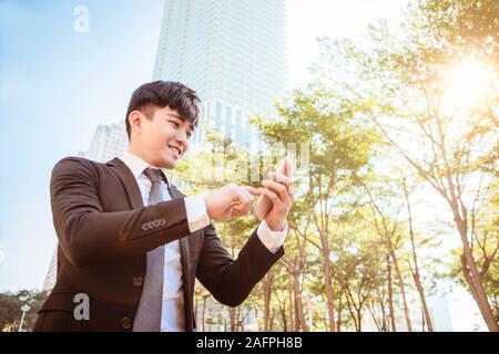 young business man using mobile phone Stock Photo