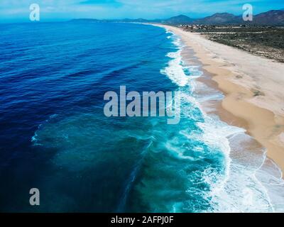 Aerial drone view of beach and coastline bright summers day