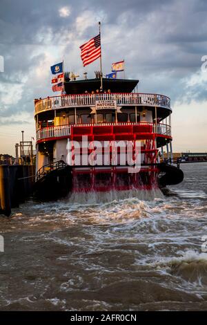 APRIL 24, 2019, NEW ORLEANS, LA, USA - Natchez Riverboat on Mississippi River in New Orleans, Louisiana at sunset Stock Photo