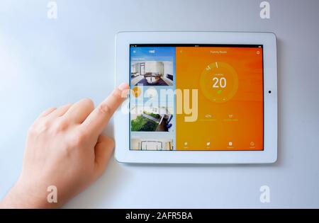 Calgary, Alberta. Canada Dec 16 2019. A person using the google Nest app on an iPad. Google Nest release a new update of its smart app on the iPad. Il Stock Photo