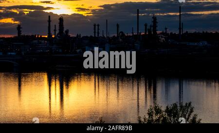 MAY 22, 2019, GREAT FALLS, MONTANA, USA - Sunset on Missouri River and Petroleum Plant, Great Falls, Montana Stock Photo