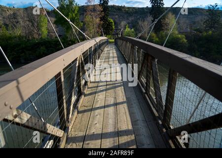 MAY 23, 2019, GREAT FALLS, MT., USA - walking bridge to The Great Falls of the Missouri River in Great Falls, Montana and hydroelectric plant Stock Photo