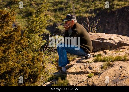 MAY 23, 2019, GREAT FALLS, MT., USA - Bill Terry ponders The Great Falls of the Missouri River in Great Falls, Montana and hydroelectric plant Stock Photo