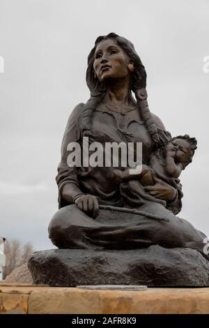 MAY 23, 2019, THREE FORKS, MT, USA - Statue in front of Sacajawea Hotel, Three Forks, Montana honors Sacajawea and the Lewis and Clark Expedition Stock Photo