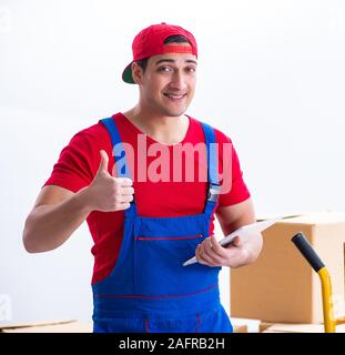 The contractor worker moving boxes during office move Stock Photo