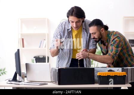 The it engineers working on hardware issue Stock Photo