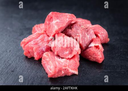 Chopped Beef Steak (selective focus) on a slate slab (close-up shot) Stock Photo