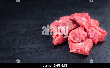 Slate Slab with chopped Beef (close-up shot; selective focus) Stock Photo