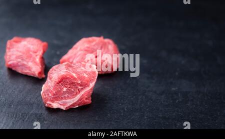 Chopped Beef Steak on a slate slab (selective focus; close-up shot) Stock Photo