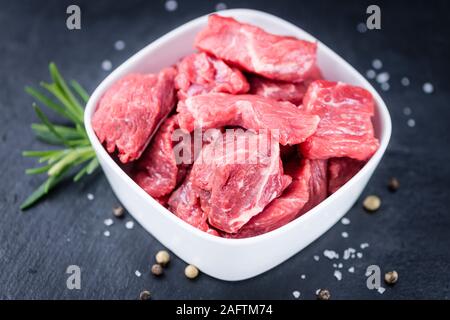 Chopped Beef Steak (selective focus) on a slate slab (close-up shot) Stock Photo