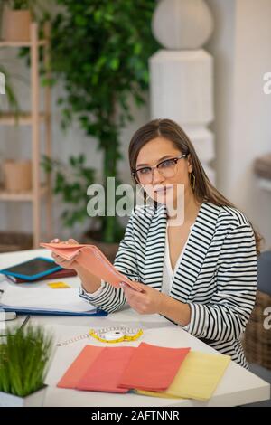 Nice professional designer working in the office Stock Photo