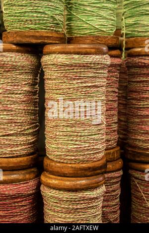 close up detail of reels of cotton yarn in Sir Richard Arkwright's cotton and textile mill at Masson Mills Museum Derbyshire UK Stock Photo