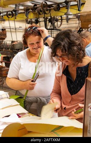 two female tourists in Sir Richard Arkwright's cotton and textile mill at Masson Mills Museum Derbyshire UK Stock Photo