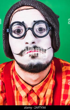 Mime poses and grimaces in the studio Stock Photo