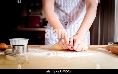 fingers on dough, chef kneads dough for baking, concept cooking, bakery Stock Photo