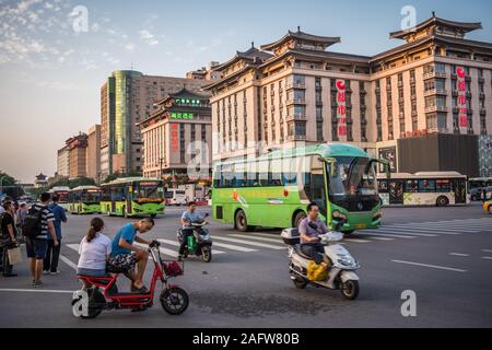 Xian, China -  August 2019 : Extremely busy street crossing and crossroad in the city of Xian in summer, Shaanxi Province Stock Photo