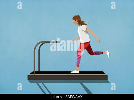 Woman running on treadmill Stock Photo
