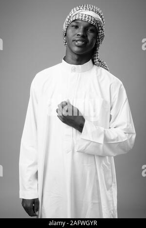 Young African man wearing traditional Muslim clothes Stock Photo