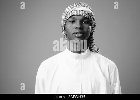 Young African man wearing traditional Muslim clothes Stock Photo