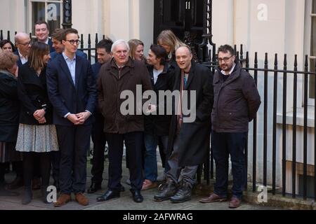 London, UK. 13 December, 2019. No. 10 Downing Street staff, including Dominic Cummings (2nd r), wait outside 11 Downing Street for newly elected Prime Stock Photo
