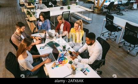 Working process. Designer team working in coworking space Stock Photo