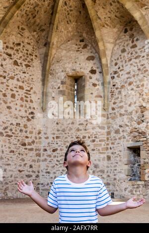 Little child Little child praying in a little chapel Stock Photo