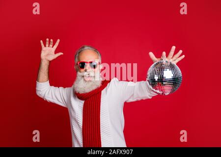 Portrait of his he nice attractive handsome cheerful cheery glad positive gray-haired man in pullover sweater having fun fest festival isolated over Stock Photo