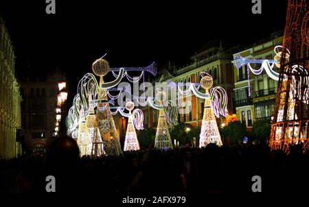 Christmas decorations in the Plaza San Francisco in Seville, Andalusia, Spain. Angels with trumpets. Show of lights and music. Stock Photo