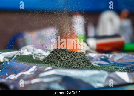 chemical reaction of ammonium dichromate if to set fire to it on the foil Stock Photo