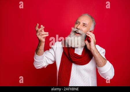 Close-up portrait of his he nice attractive cheerful cheery dreamy positive gray-haired man talking with family friends far away isolated over bright Stock Photo