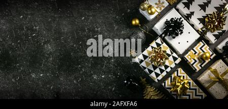 Christmas concept - black and golden presents and decorations Stock Photo