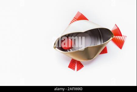 Fish of plastic and can isolated on white Stock Photo