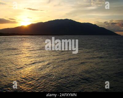 The volcanic Mindoro island, part of The Philippines archipelago, seen from the sea Stock Photo