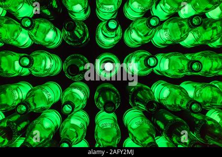 St.Petersburg, Russia - December 17, 2017: illuminated installation made of  bright green Tuborg beer bottles, top view Stock Photo