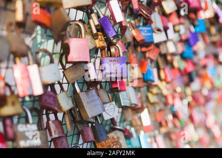 St.Petersburg, Russia - November 30, 2018: Love locks hang on a bridge railings in Saint-Petersburg Stock Photo