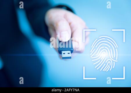 USB Key Lock Access with Fingerprint Biometrics Scanner for future data security technology concept. Stock Photo