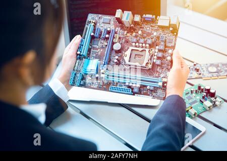 Engineer inspect final production of Printed circuit computer logic board prepare for mass production process. Stock Photo