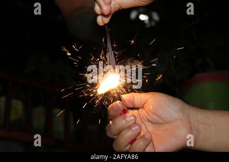 Small fireworks are lit at the new year's event Stock Photo