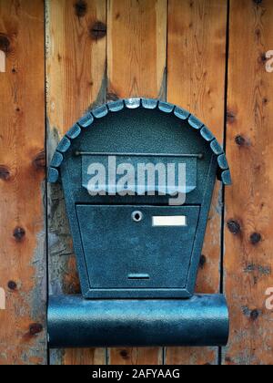 Mailbox for newspapers and letters on wooden door Stock Photo
