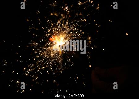 Small fireworks are lit at the new year's event Stock Photo